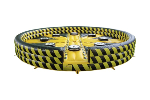 Wipeout challenge mat with sweeper arms for festivals